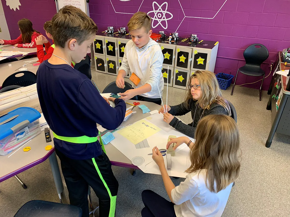 Students working together on a STEMvelope activity