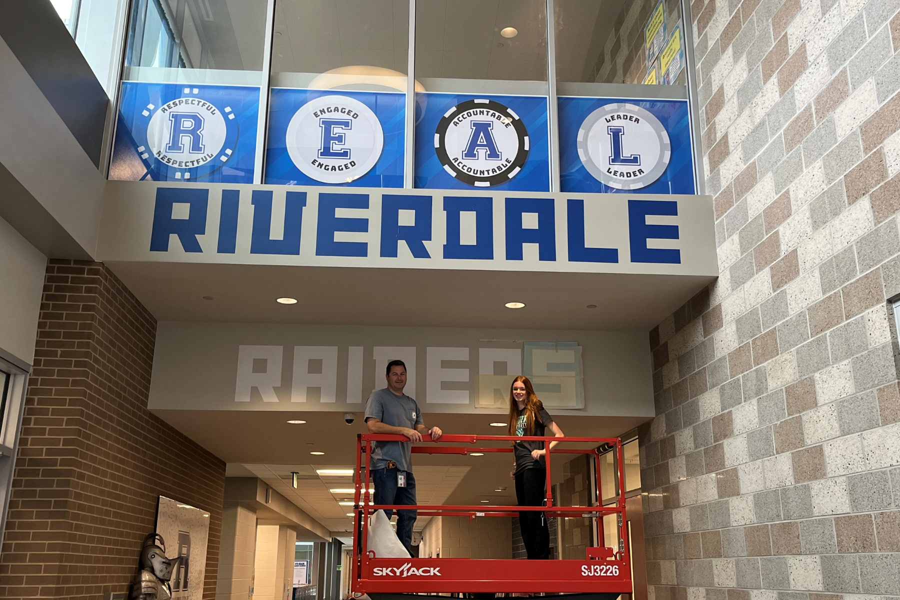 A student-designed graphic in a school hallway, printed using Educator Plus